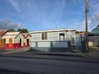 Authentic Suburban Retreat: AC Bedroom, Wi-Fi, 5 Mins to Bridgetown & Beach