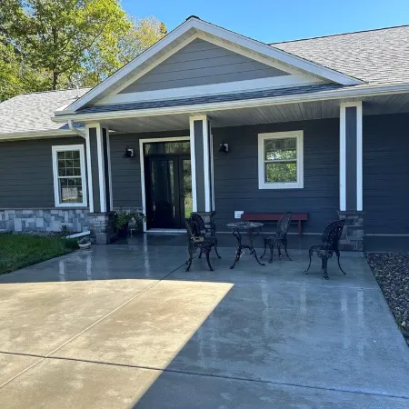 BEAUTIFUL lake front home with a private beach, dock and large yard