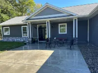 BEAUTIFUL lake front home with a private beach, dock and large yard