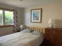 New 2 BR condo & private courtyard. CLEAN. Modern Kitchen. Walk/bike to town. Hotels in Douglas