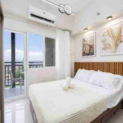 Elegant Wood-Accent Studio with Balcony Rooms