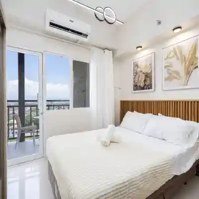 Elegant Wood-Accent Studio with Balcony Rooms