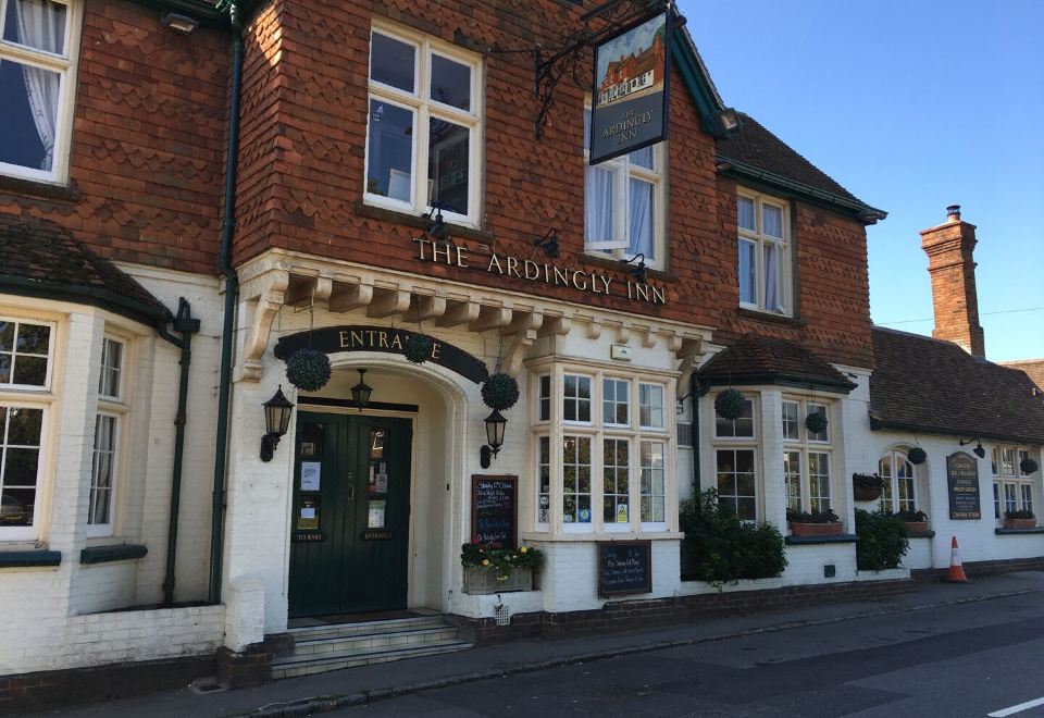 "a brick building with a sign that reads "" the admiralty inn "" prominently displayed on the front" at The Ardingly Inn