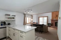 NEW Ski in/out condo with Mt views, hot tub, porch, gym & wifi!