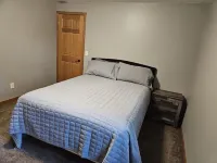 Three bedroom hide-a-way with spacious deck over looking Island Lake.