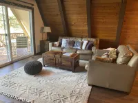 Private cabin in a small mountain town surrounded by pine trees. Snow getaway