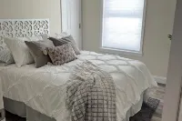 Cozy 4-bedroom house with AC and WiFi in Centereach, New York.