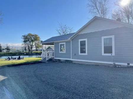 Cozy riverfront cottage with an easy beach-inspired coastal MI vibe!