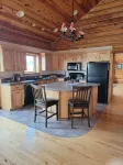 Large garage for bikes. Beautiful log home.  On golf course.