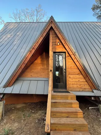 Modern lakefront cabin nestled in the piney woods of East Texas. Pet Friendly!