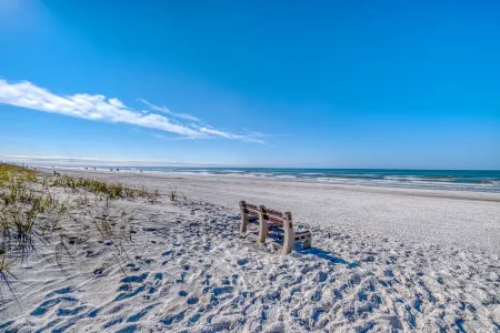 THIS STUNNING home is RENOVATED and furnished  W/Beach Access a block away!