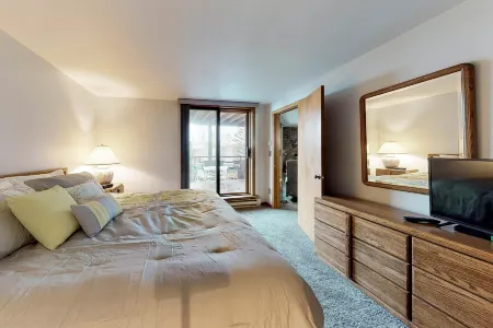 Lakefront Condo with Mountain Views & Shared Hot Tub - Walk to Town & Ski Access