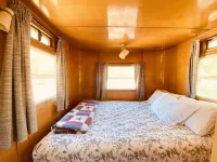 Vintage wood paneled travel trailer on Kernville Ranch with horses and hot tub