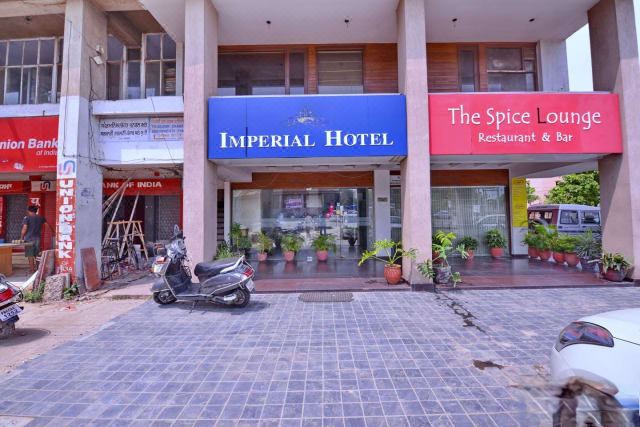 "a building with a sign that reads "" imperial hotel "" prominently displayed on the front of the building" at Imperial Hotel