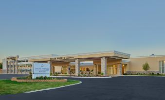 "a large building with a blue sign that says "" delta hotels "" is shown in the image" at Delta Hotels Chicago Willowbrook