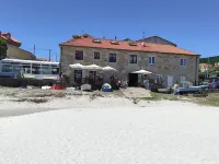 The apartment is located in front of Langosteira beach, with stunning views.