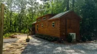 Secluded cozy tiny cabin on the water with fire pit and private dock