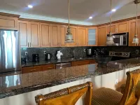 Entire condominium with a pool view, steps from the beach