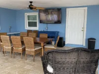 Large outdoor space with pool/hot tub, on 200ft wide canal- quick ride to Ocean!