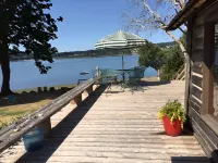 Bainbridge Island Water's Edge Log Cabin just feet from the beach!  Pet Friendly Hotels in Bainbridge Island