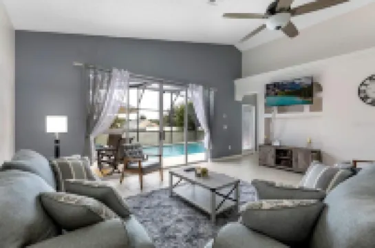 Lovely home near Disney with a Heated pool and game room in a resort community.
