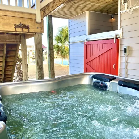 Waterfront; Golf Cart option; hot tub; Kayaks; Peddle Boat; Walk to beach; Ramp