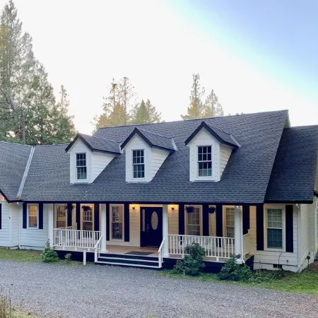 Amazing sunsets!! Water view, hot tub, close to town, fire pit.