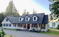 Amazing sunsets!! Water view, hot tub, close to town, fire pit. - 3-Star