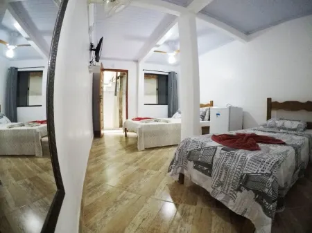 Suítes Cantinho da Pedra Отели рядом с достопримечательностью «Лопес Мендес Бич»