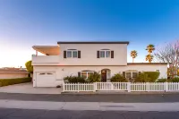 Spacious Deck with Peek-a-Boo Water Views - Exquisite Coastal Haven