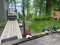 Waterfront retreat on 7 private wooded acres with beautiful sunset views.