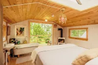 Treehouse lifted up over a stocked trout pond up in the beautiful birch trees!