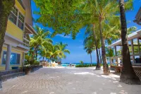 Oceanfront beach house with dual-masters & screened balcony on West Bay Beach