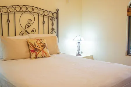 Private Suite 104, with beautiful gardens, shared pool and BBQ area!