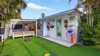 Swim Spa Retreat w/ Game Room, EV Charger, Near Las Olas Casa Pineapple Social by Avantstay