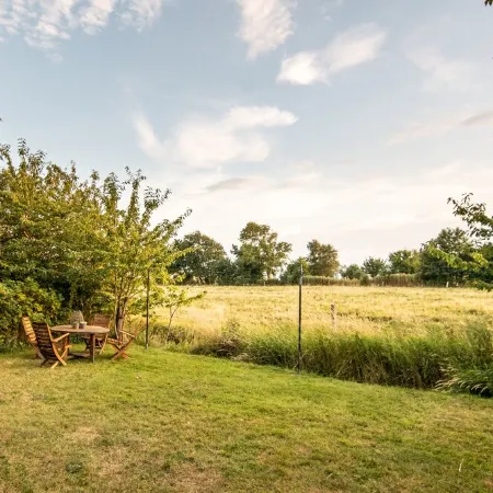 Spacious vacation apartment with garden, surrounded by greenery.