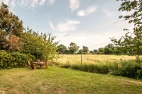 Spacious vacation apartment with garden, surrounded by greenery.