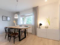 Spacious vacation apartment with garden, surrounded by greenery.