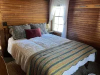 Sunny cottage built over the water on the St. Lawrence River