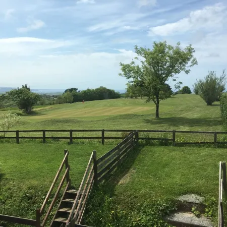 Barn conversion overlooking the golf course to the sea