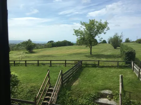 Barn conversion overlooking the golf course to the sea