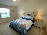 Charming Corner Lot with Golf Cart and Screened Lanai - Inviting Escape