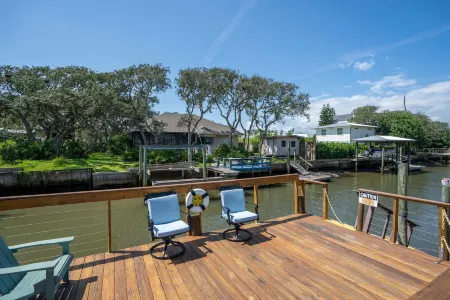 Canal Front Access and Outdoor Patio - Charming Beachside Retreat