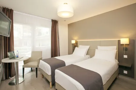 Séjours & Affaires Courbevoie Grande Arche Отели рядом с достопримечательностью «Pavillon des Indes»