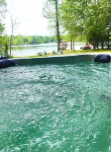 Enchanting 5-Bed/5-Bath Lakefront Log Cabin with Private Cove, Beach & Hot Tub.