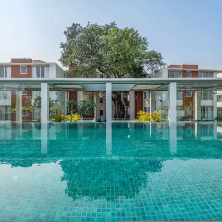 Modern 2BHK w Rooftop Pool 10 Mins Drive to Beach
