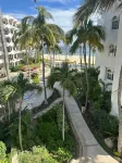 Surf and Chill: Beachfront 2-bed condo with pools, gym, steps to surf breaks