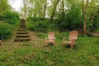 Rustic Riverside A-Frame Retreat: Secluded Charm.