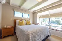 All day sun house with metres away from the golden sands of Onetangi Beach.