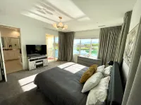 "Luxury Lakefront Paradise: Heated Pool Haven with Unrivaled Views"